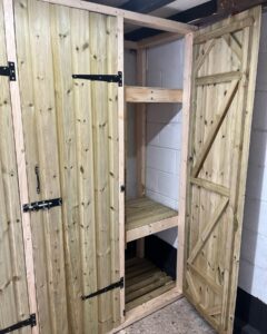 Wooden storage cabinet with double doors and two shelves, designed for organization and efficient space use. Ideal for home or office storage solutions.